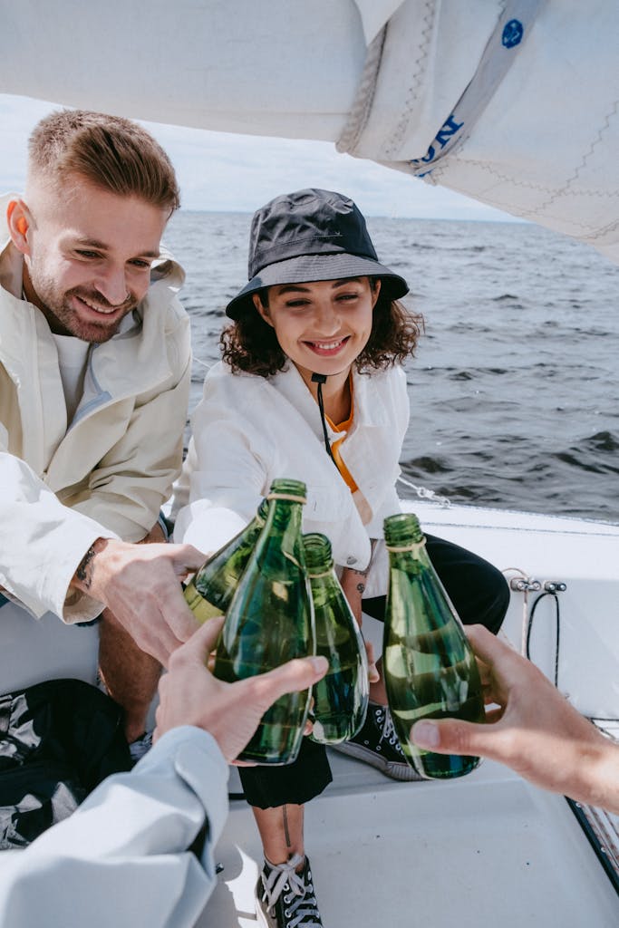 Man in White Dress Shirt Holding Green Glass Bottle